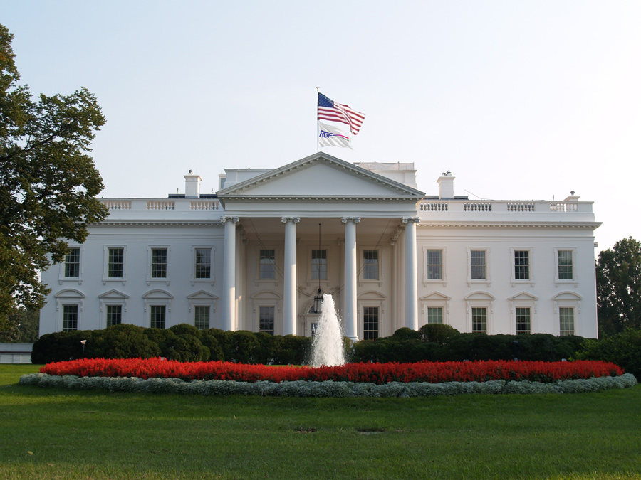 Whitehouse with American and RGF flags
